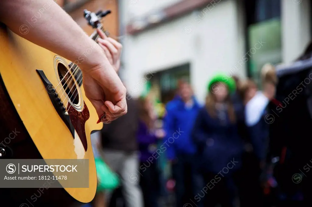 Dublin, Ireland, A Musician Plays His Guitar In The Street