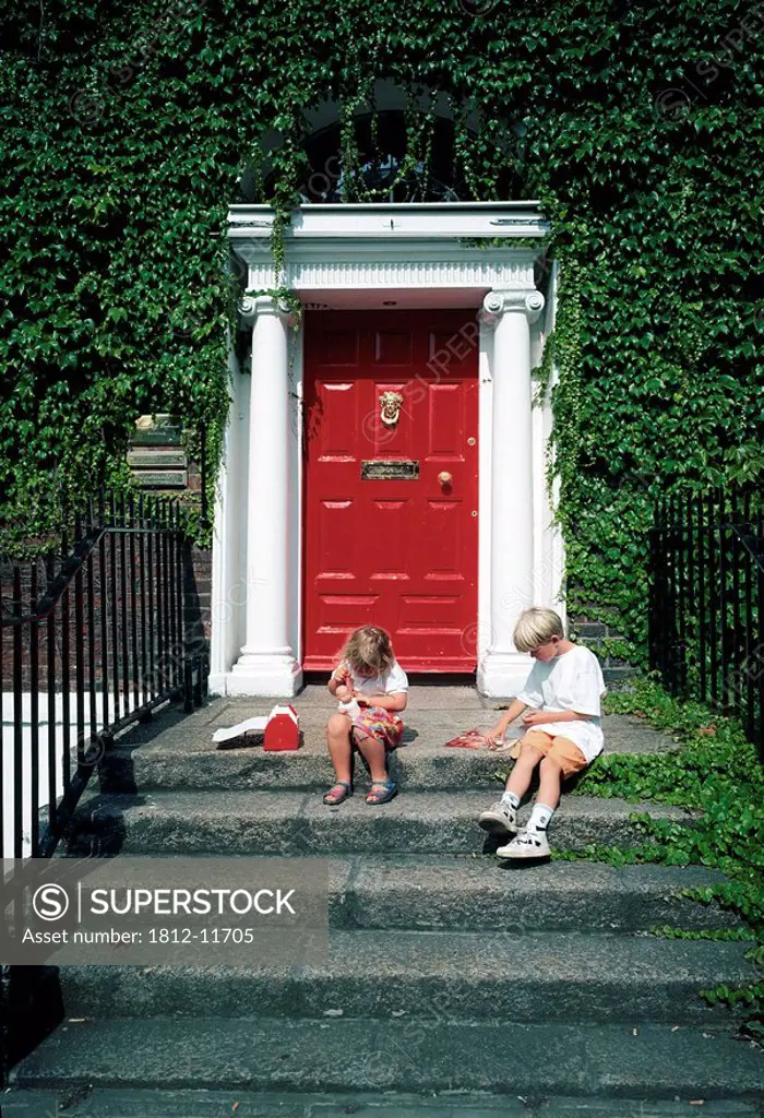 Dublin, Co Dublin, Ireland, Children Sitting Outside Georgian House