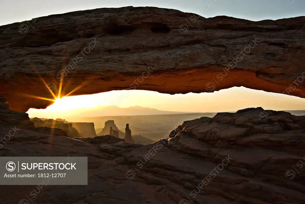 Canyonlands National Park, Utah, Usa, Sunset Through Arch Of Rock Formation