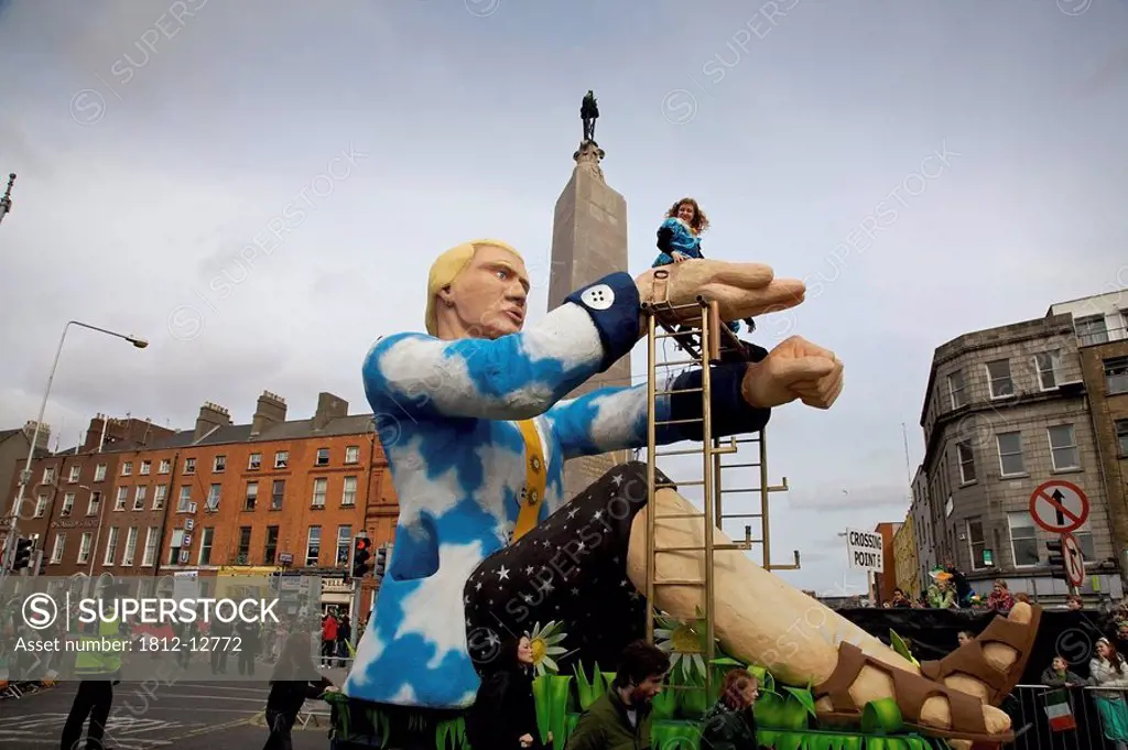Dublin, Ireland, A Parade Float With A Giant Man Holding A Small Woman