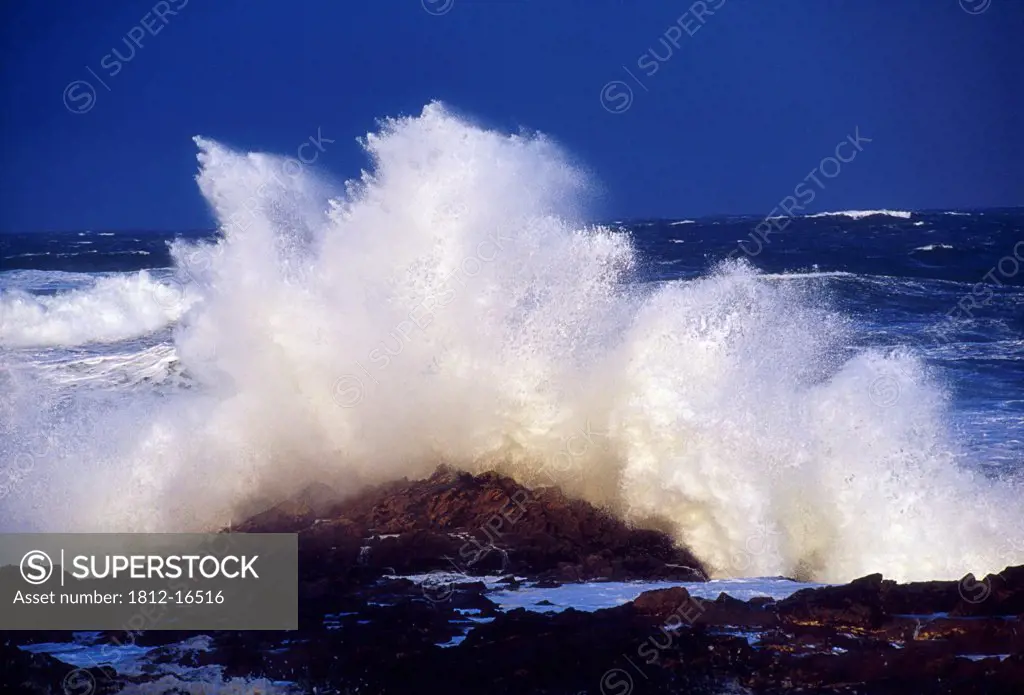 Inishowen Peninsula, County Donegal, Ireland; Wave Breaking Against The Shore