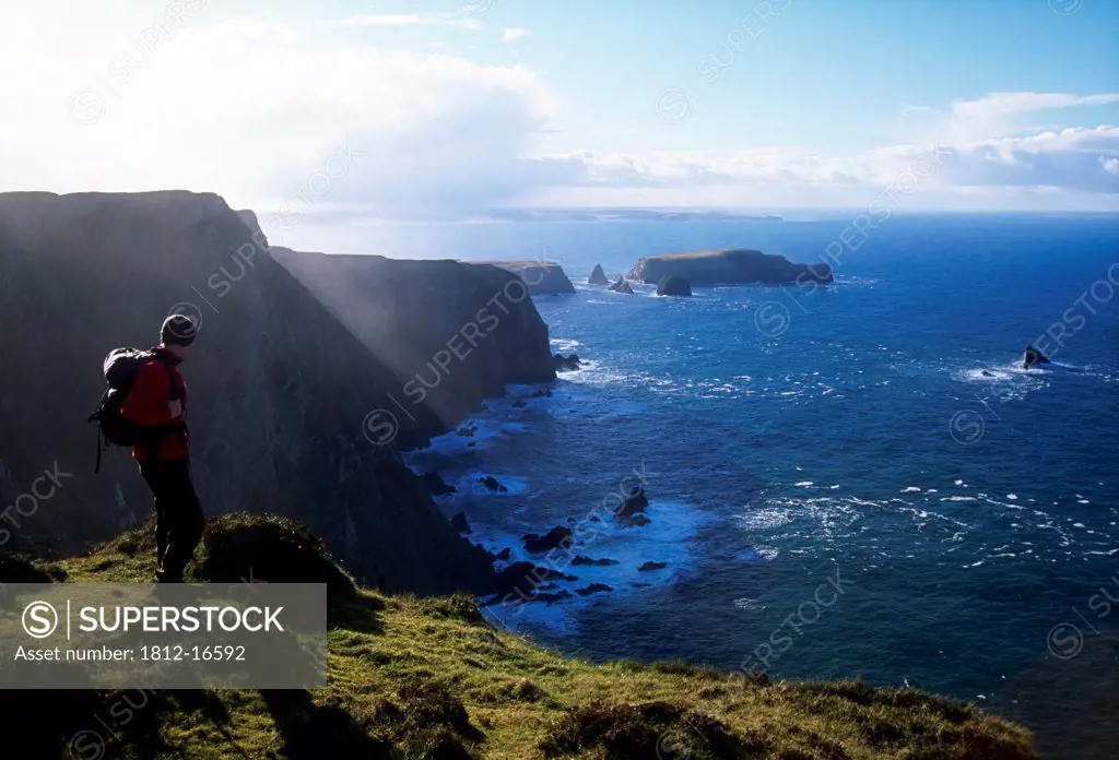Kid Island From Benwee Head, County Mayo, Ireland; Hiker Enjoying Coastal View