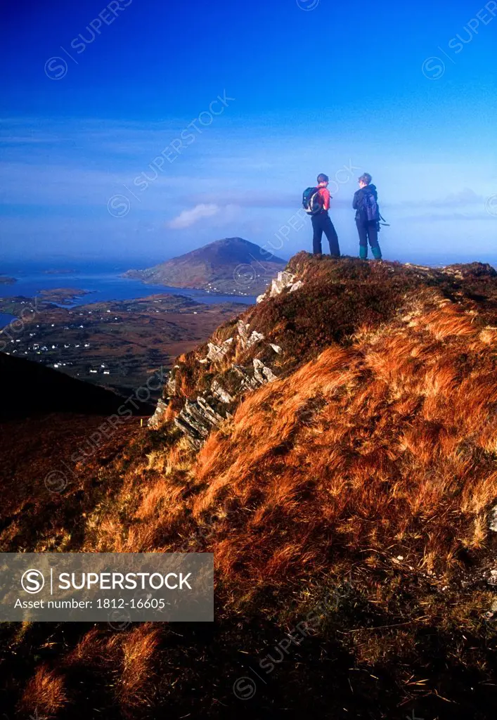 Diamond Hill, Connemara, County Galway, Ireland; Hikers On Mountain Summit