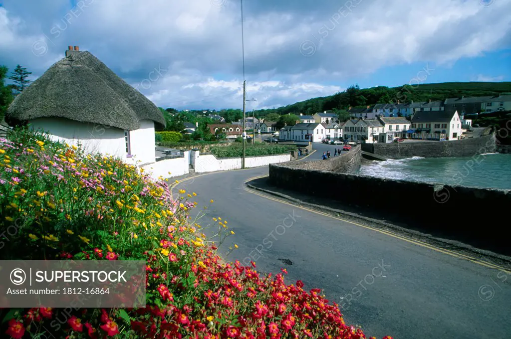 Dunmore East, County Waterford, Ireland; Thatched Cottage By The Sea
