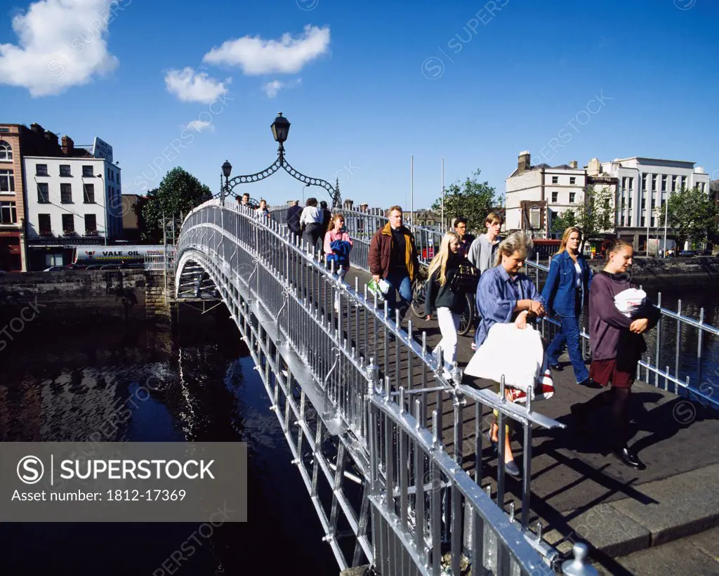 Ha'penny Bridge, Dublin City, Ireland; People Crossing Pedestrian Bridge