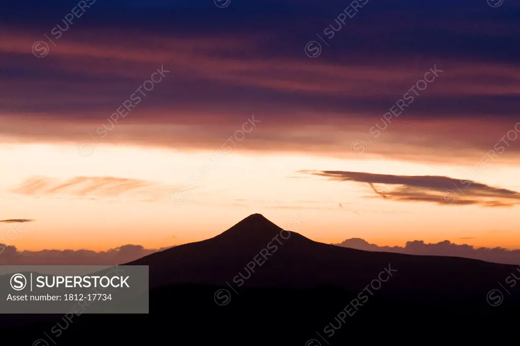 Great Sugar Loaf, County Wicklow, Ireland; Mountain Silhouette At Dawn