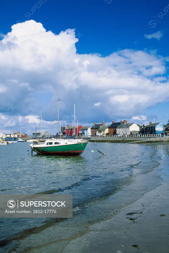 Skerries Harbour, County Dublin, Ireland; Boat Near Shore Of Coastal Village