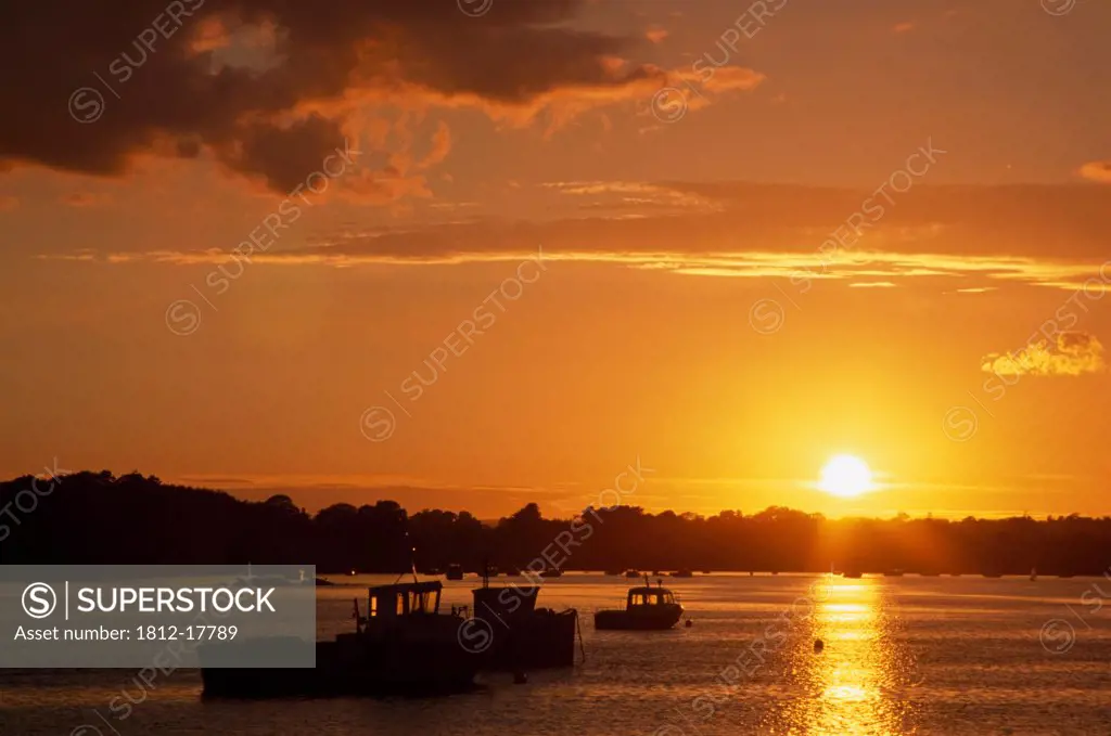 Wexford Harbour, County Wexford, Ireland; Sunset Over Boats In Harbour