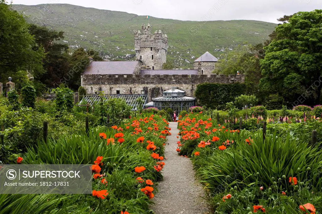 Glenveagh National Park, County Donegal, Ireland; Flowering Irish Garden With Castle In Background