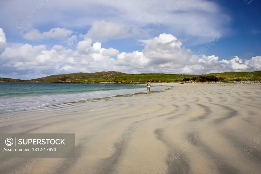 Cleggan, County Galway, Ireland; Girl Walking On Beach