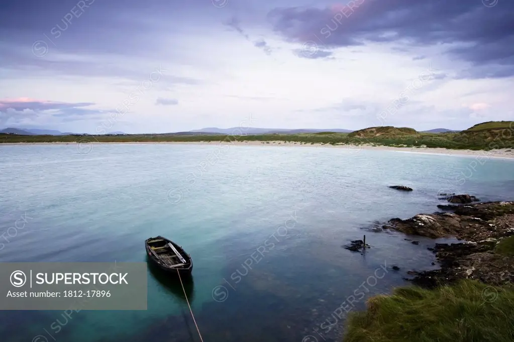 Dogs Bay, Roundstone, County Galway, Ireland; Fishing Boat In Water At Sunset