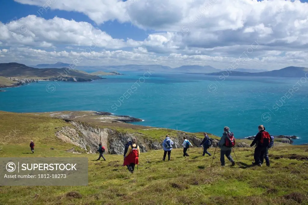Menawn Cliffs, Achill Island, Co Mayo, Ireland; Hikers Descending The Menawn Cliffs