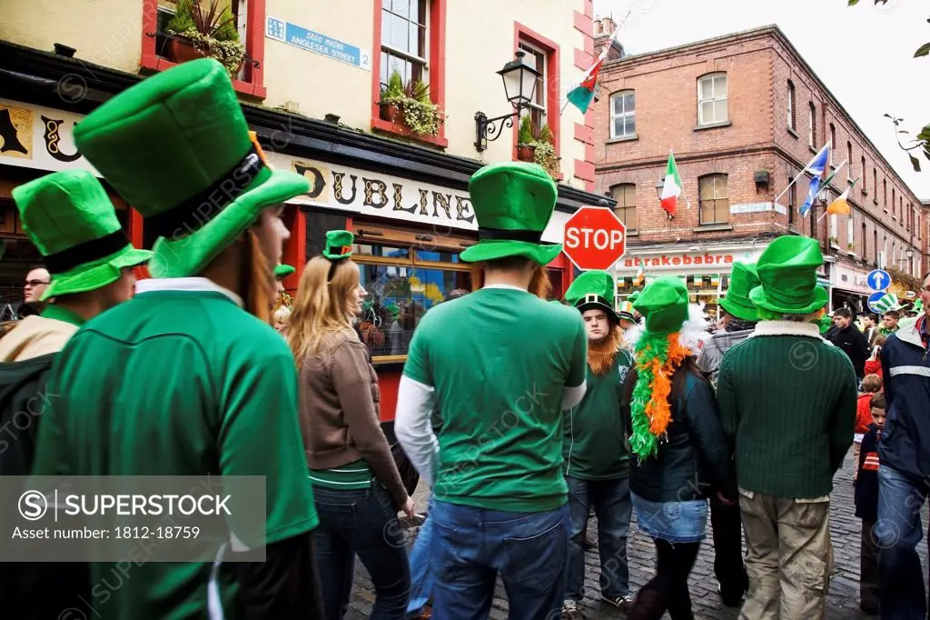 Dublin, Ireland; People Gathered In The Street Wearing Big Green Hats For Saint Patrick's Day