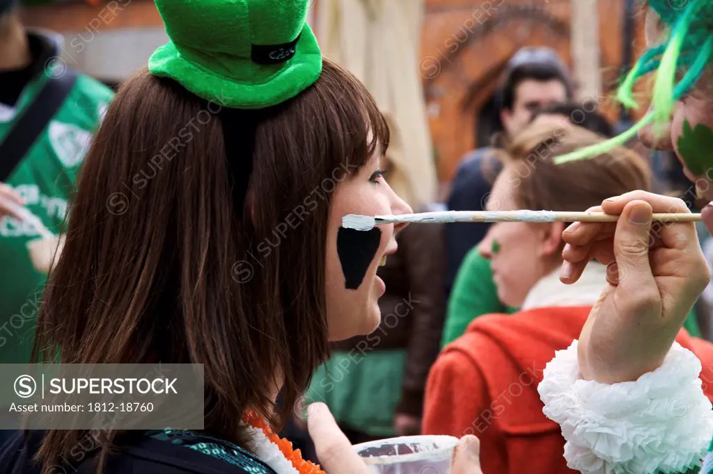 Dublin, Ireland; A Woman Gets Her Face Painted For Saint Patrick's Day