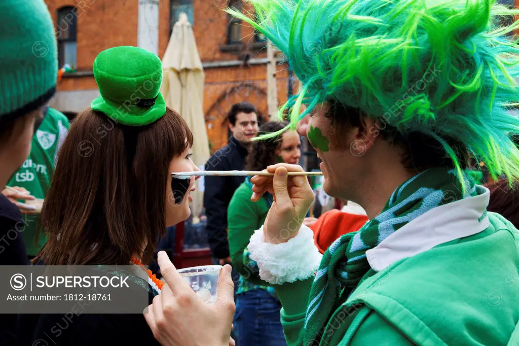 Dublin, Ireland; A Woman Gets Her Face Painted For Saint Patrick's Day