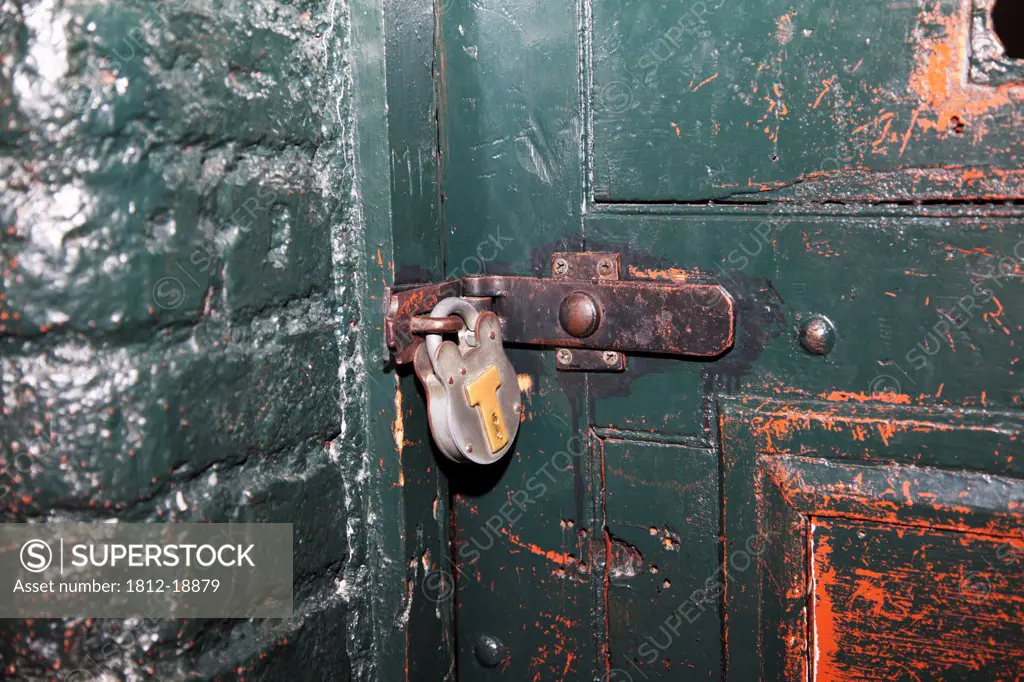 An Old Door And Padlock In Kilmainham Jail; Dublin, Dublin County, Ireland