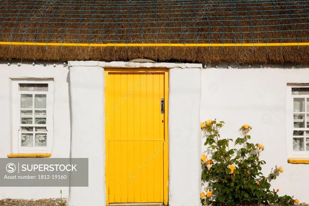 Traditional Irish Cottage With A Yellow Door; Malin Head, County Donegal, Ireland