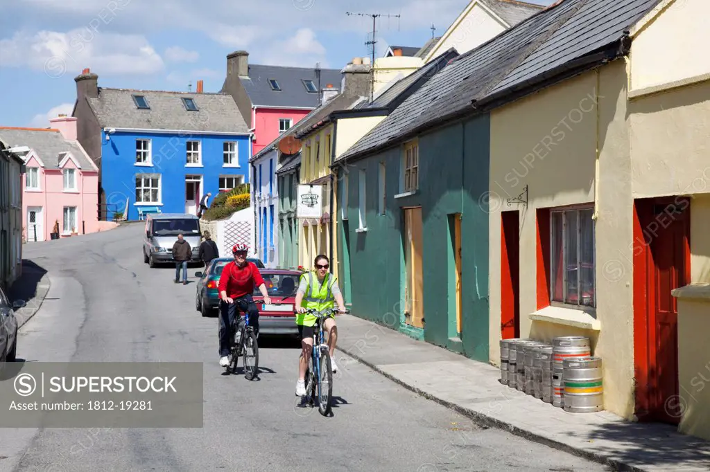 Cyclists On Village Street; Eyeries, County Cork, Ireland