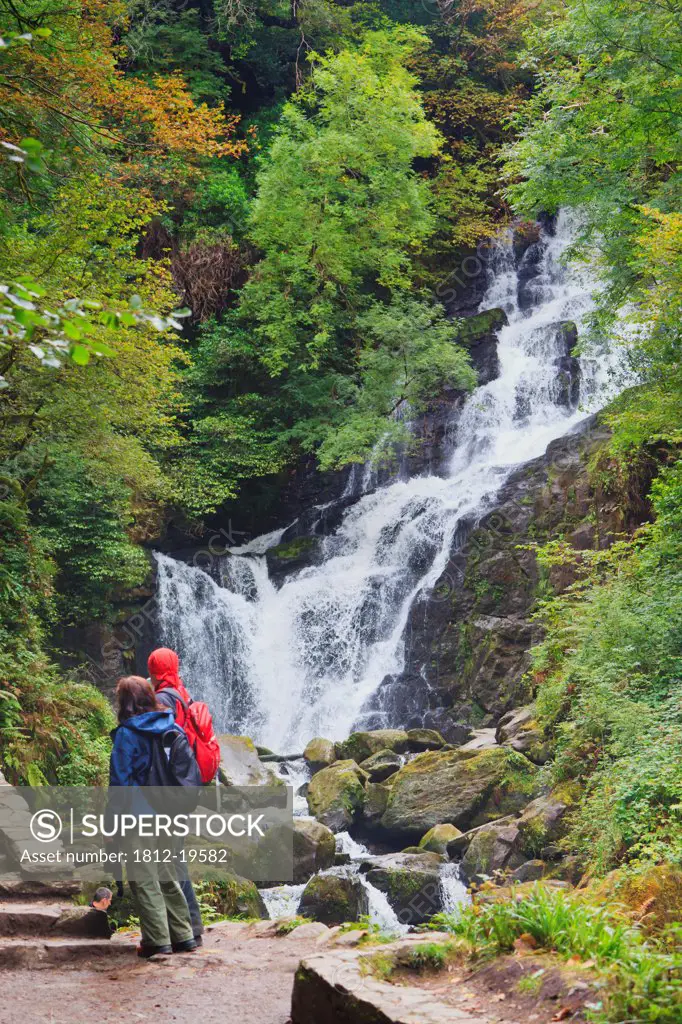 Visitors Taking Photographs Of Torc Waterfall In Killarney National Park; County Kerry Republic Of Ireland