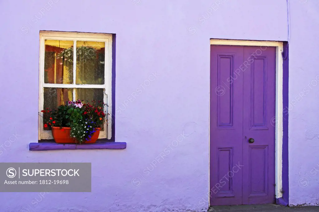 Purple House With Flower Box In Window On The Beara Peninsula In West Cork In Munster Region; Eyeries Village County Cork Ireland