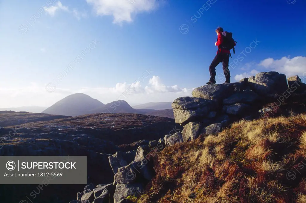 Dooish Mountain, County Donegal, Ireland; Hiker at mountain summit