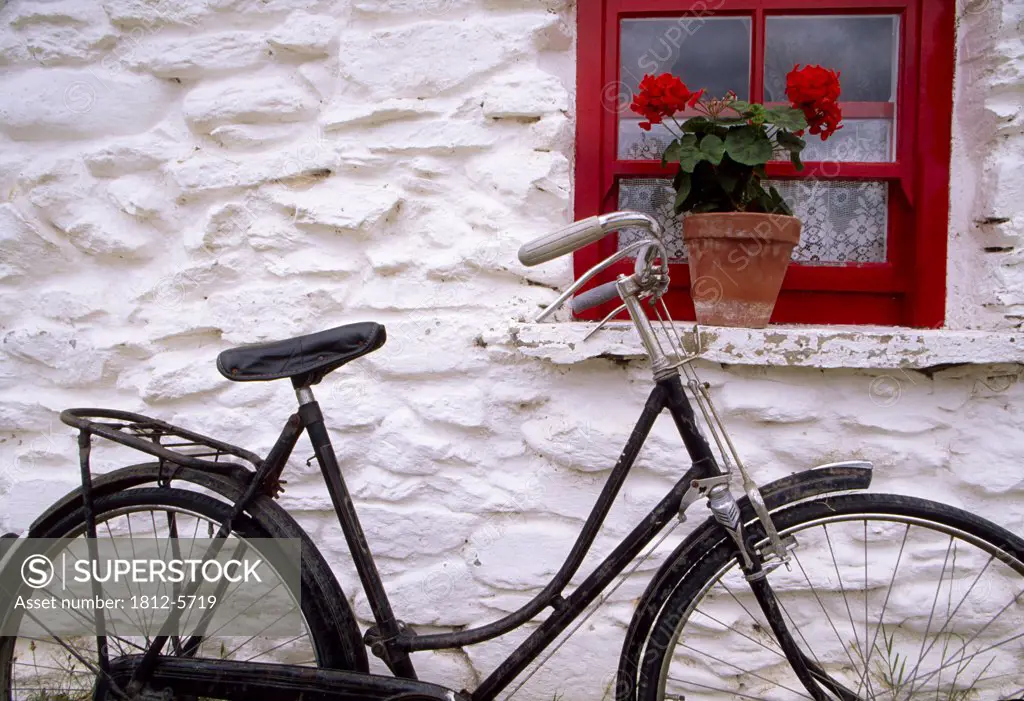 Bunratty Folk Park, County Clare, Ireland; Cottage window and bicycle