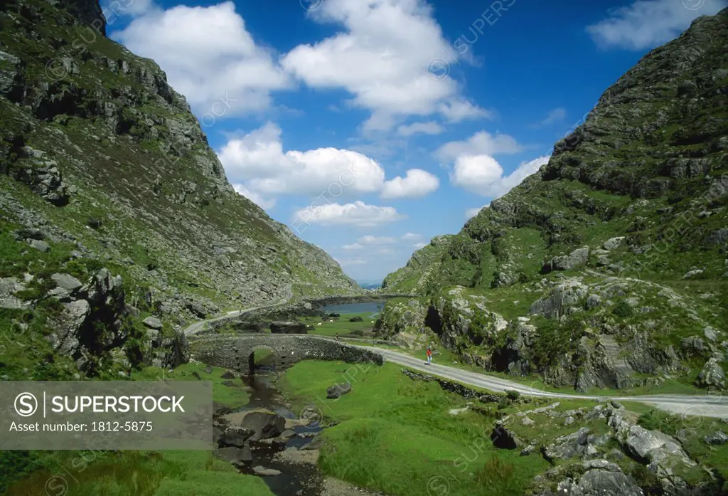 Gap of Dunloe, Killarney National Park, County Kerry, Ireland; Cyclists in the distance
