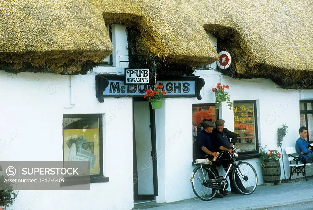 McDonough´s Pub, Oranmore, Co Galway, Ireland, Three men outside of a pub