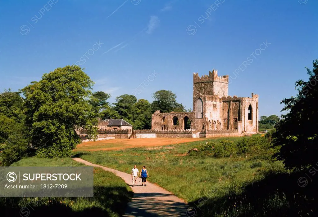 Tintern Abbey, Co Wexford, Ireland, Two people leaving an abbey founded in 1131