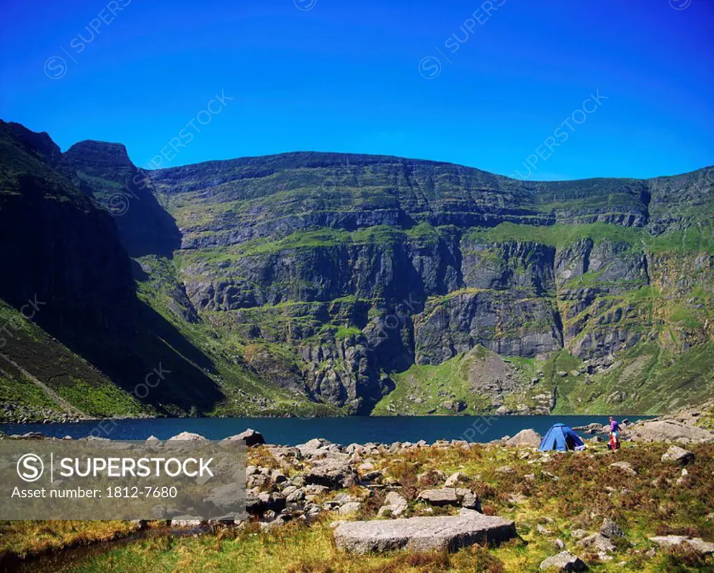 Co Waterford, Ireland, People camping by the Comeragh Mountains and lake Coumshingaun