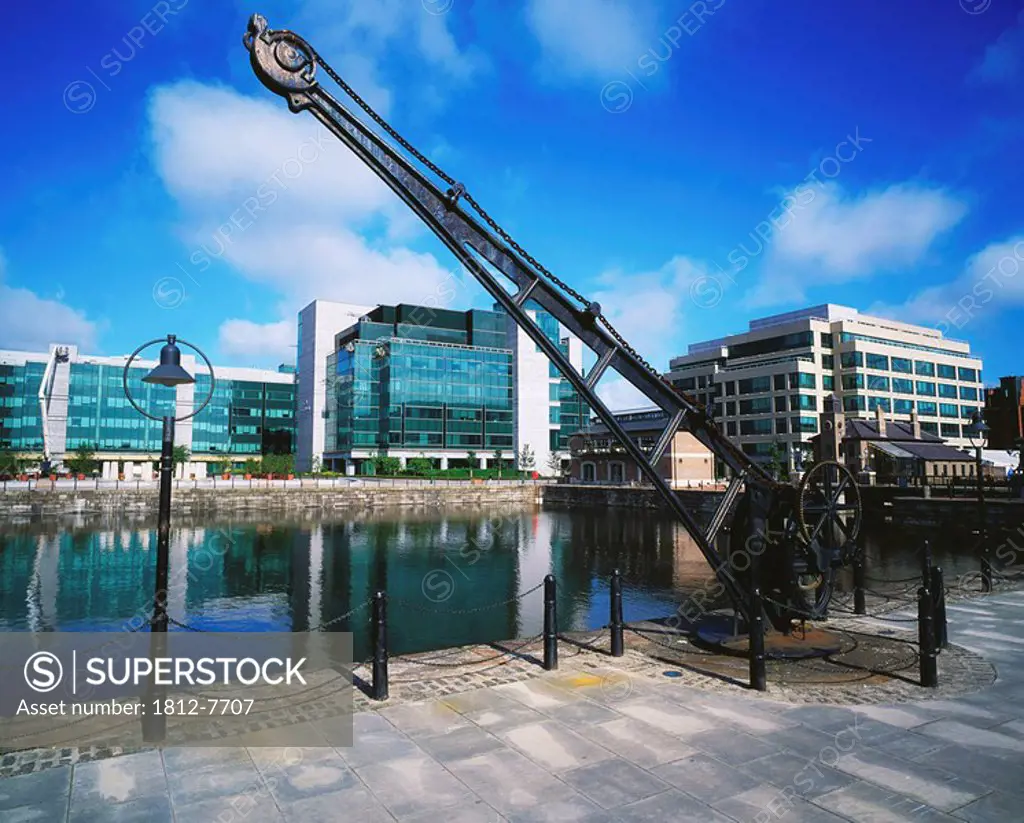 IFSC, Dublin City, Ireland, Riverside sculpture against cityscape