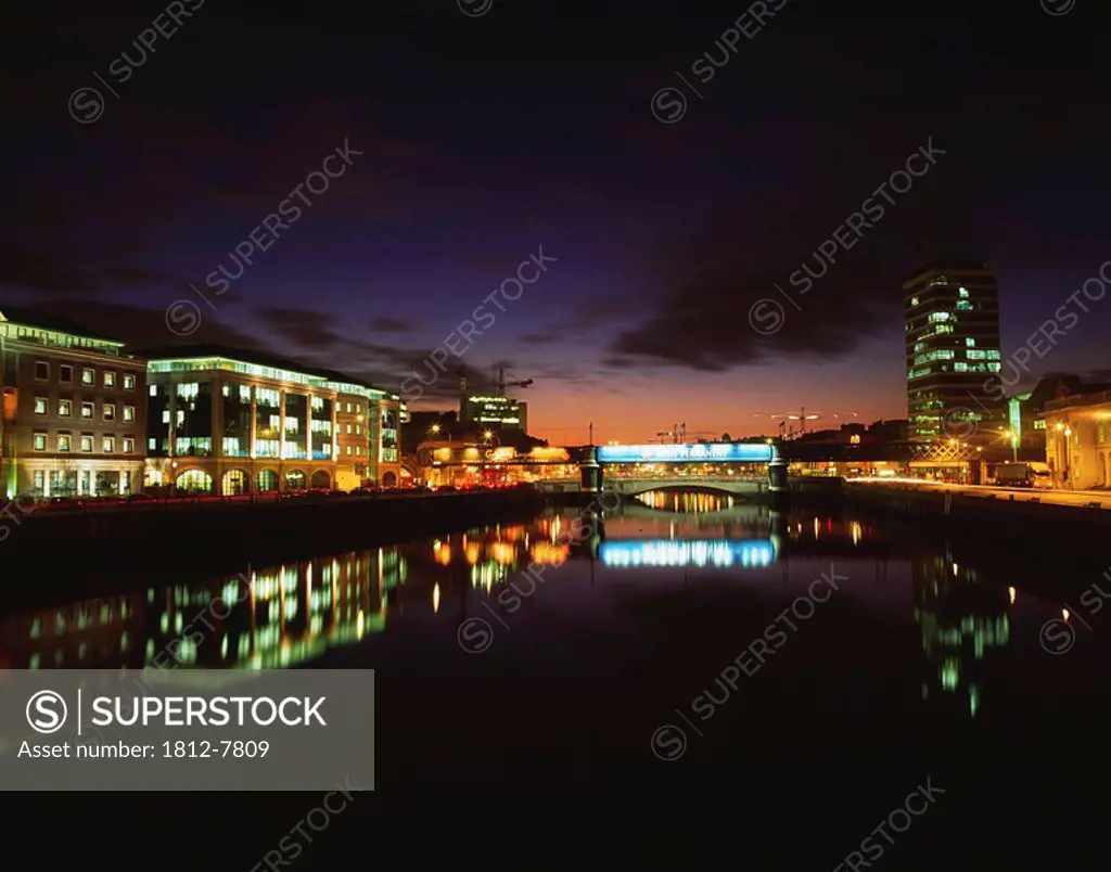 Dublin, Co Dublin, Ireland, River Liffey and quay illuminated at night