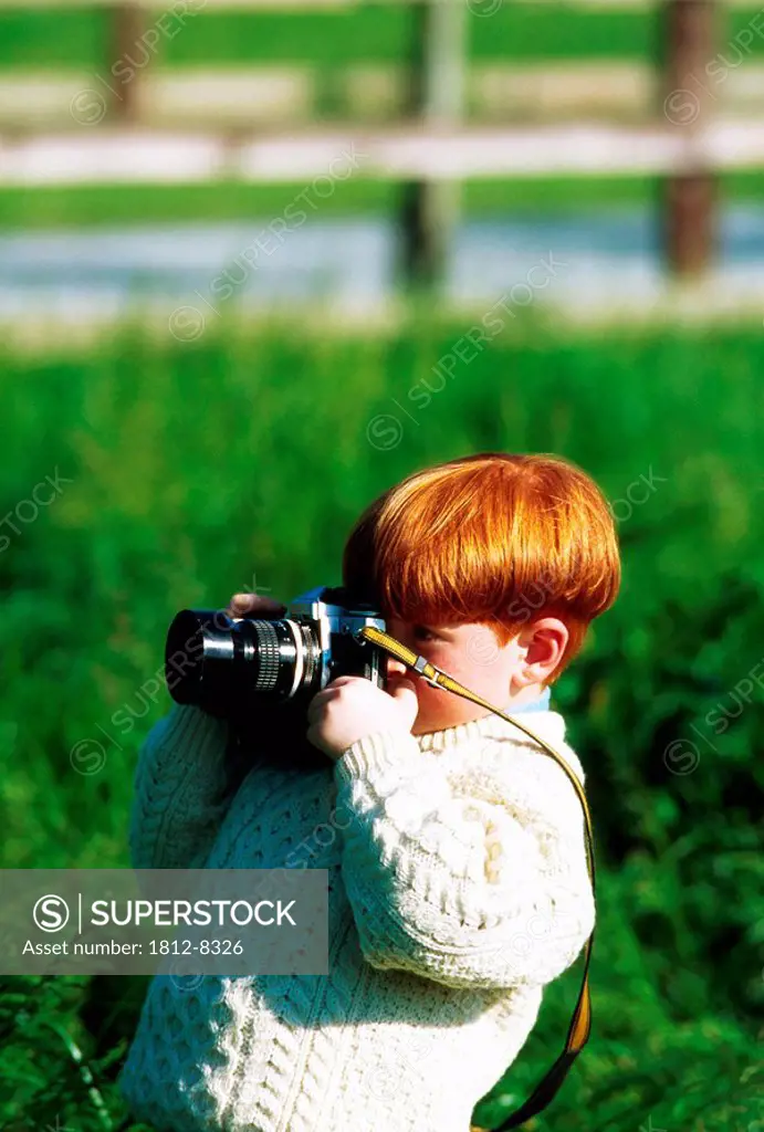Ireland, Boy taking a picture