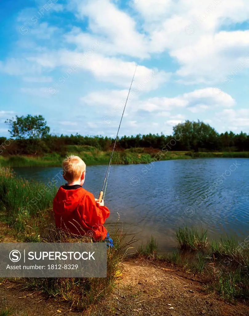 Co Antrim, Ireland, Boy fishing
