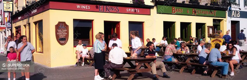 Clifden, Co Galway, Ireland, People sitting outside of a pub