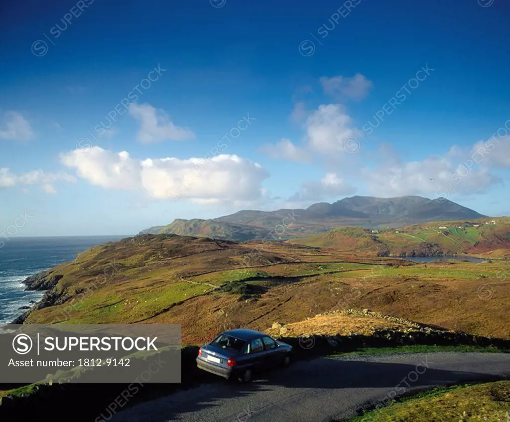 Near Kilcar, Killybegs, Co Donegal, Ireland, Car driving near the coast of Ireland