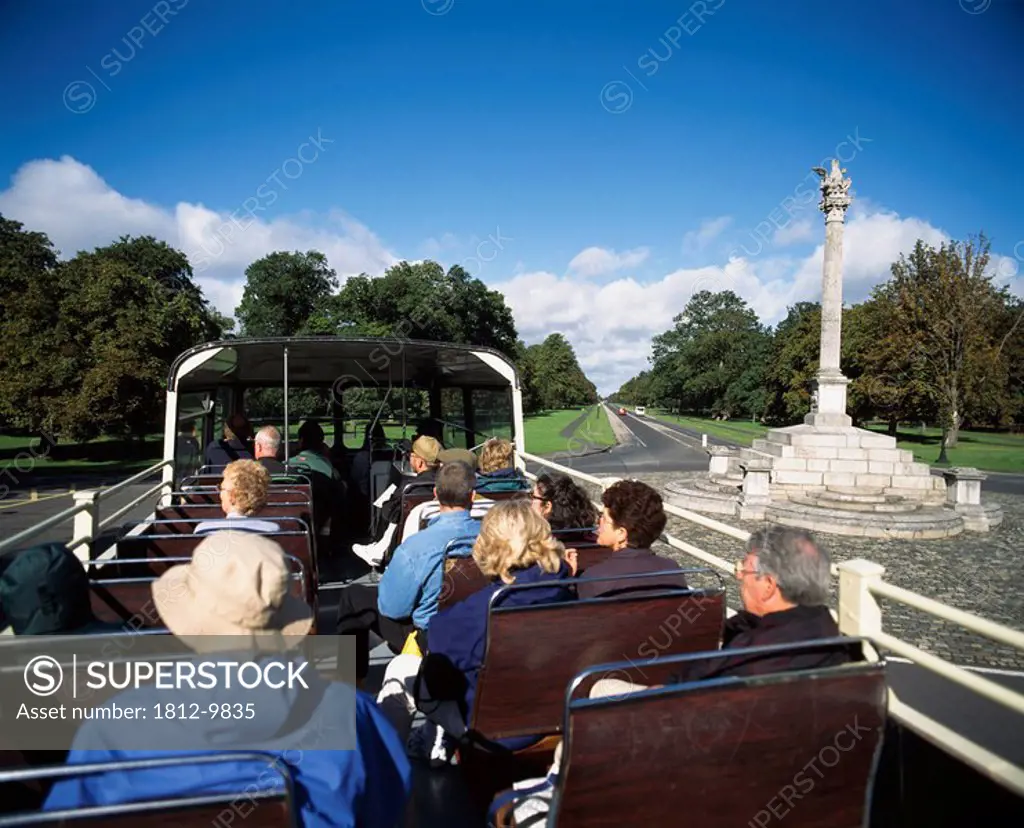 Phoenix Column, Phoenix Park, Dublin City, Ireland, Tourists on open top bus viewing monument in park