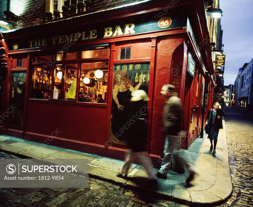 Temple Bar, Dublin City, Ireland, Pedestrians walking by traditional Irish pub