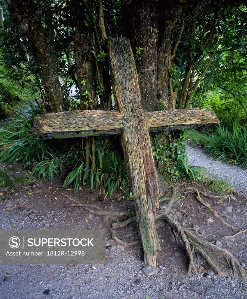 Money offering in a cross in Gougane Barra, County Cork, Ireland