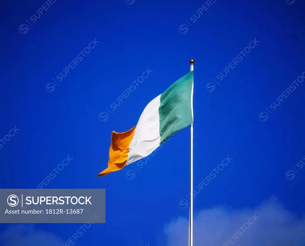 Irish flag against blue sky