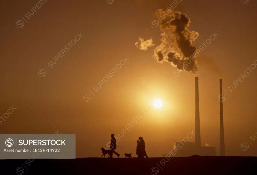 Poolbeg,Co Dublin,Ireland,Silhouette Of People Walking Past Power Station
