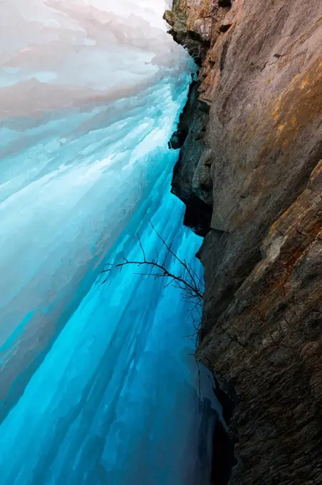 View behind a frozen waterfall in the Alaska Range; Alaska, United States of America