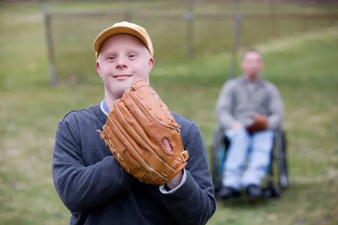 Man with Down Syndrome wearing a baseball glove