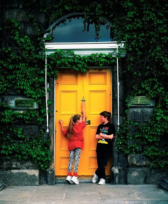Boy And Girl Standing By A Door, Merrion Square, Dublin, Co Dublin, Ireland
