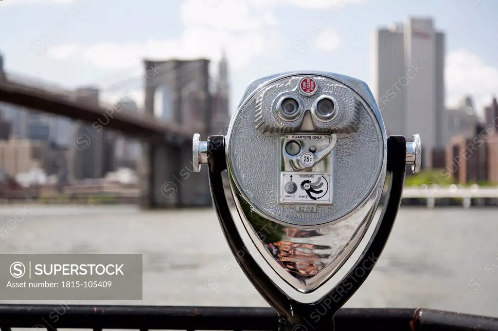 USA, New York City, Coin operated Binoculars in foreground of city
