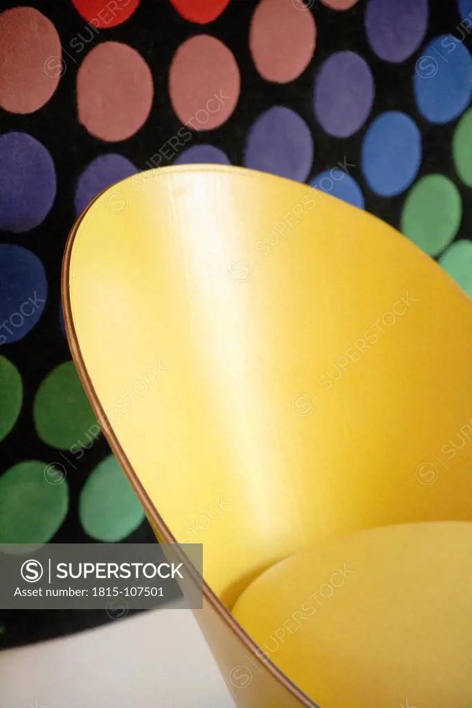 Germany, Upper Bavaria, Munich, Designed chair in new house with multicoloured background