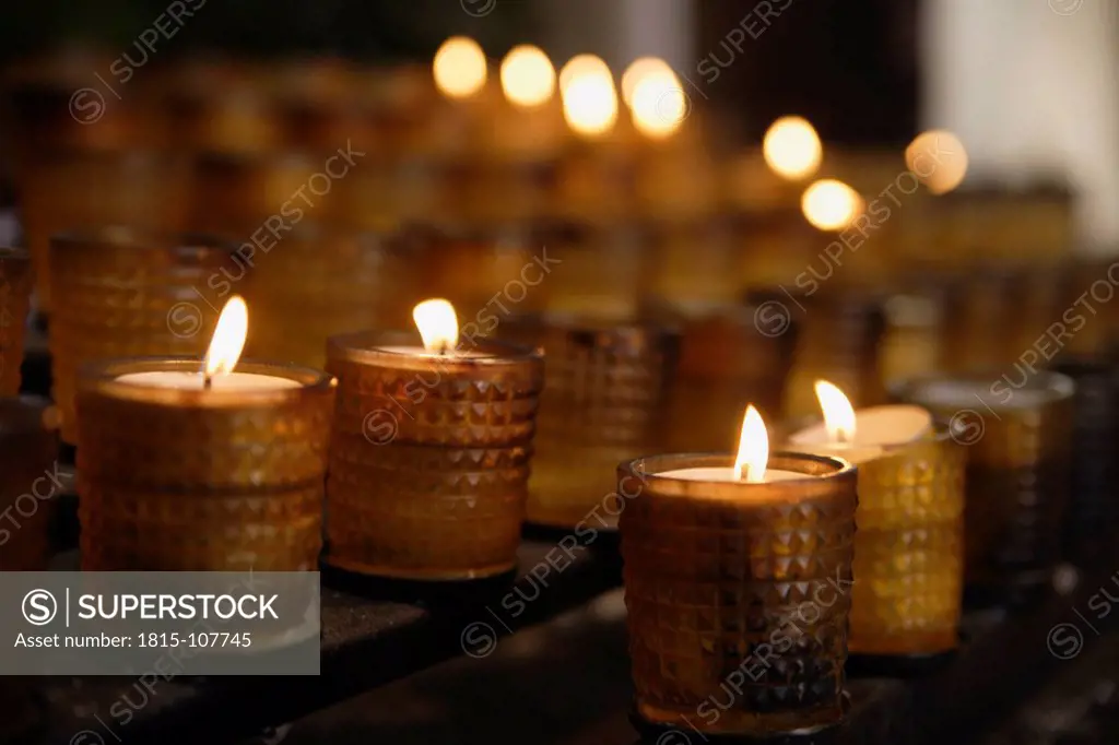 Germany, Schaeftlarn, View of candles for rogation in church, close up