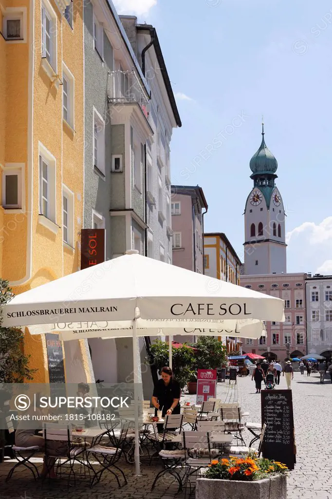 Germany, Bavaria, Upper Bavaria, Rosenheim, View of outdoor cafe with church in background