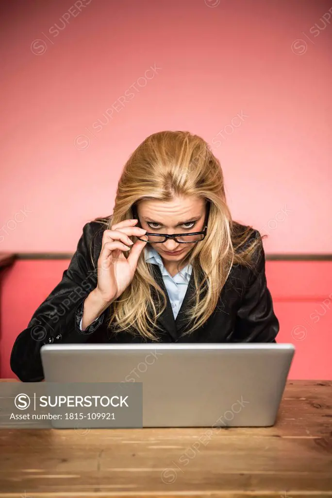 Germany, Stuttgart, Businesswoman looking in laptop