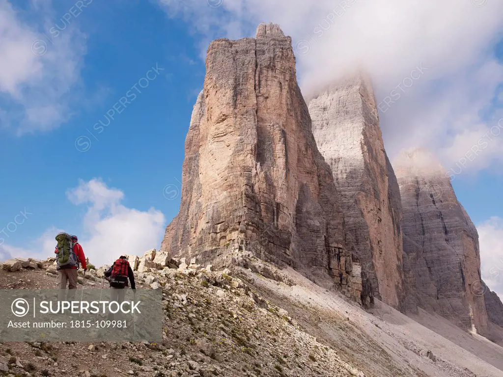 Europe, Italy, Hikers on Tre Cime di Lavaredo at National Park of Sesto Dolomities